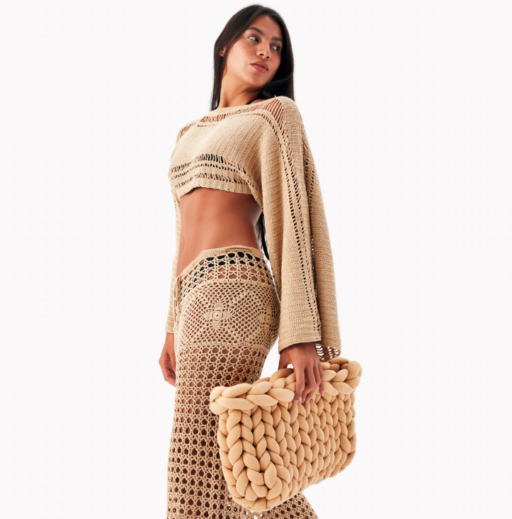 Beige handcrafted crochet set and textured beige bag on a light background